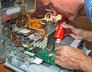 man fixing computer